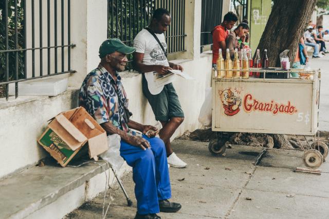 A man int the vibrant streets of Old Havana, Cuba, capturing the essence of the city's rich history and cultural charm.